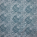 Crystal Teal hibiscus and traditional Polynesian tattoo tribal print poly cotton fabric.