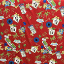 Jackpot on a Strip Hawaiian fabric print featuring Las Vegas casino signs, roulette wheels, playing cards, dice, and tropical palm trees on red background.