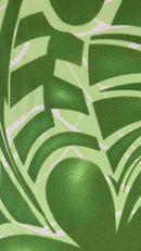 A close-up video showcasing a green and white polyester fabric featuring a tropical Monstera leaf pattern. The camera pans across the textile, highlighting the vibrant lime and forest green tones of the botanical print and the smooth, woven texture of the fabric.